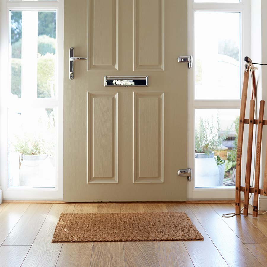 Modern door in light cream colour with chrome handle and hinges