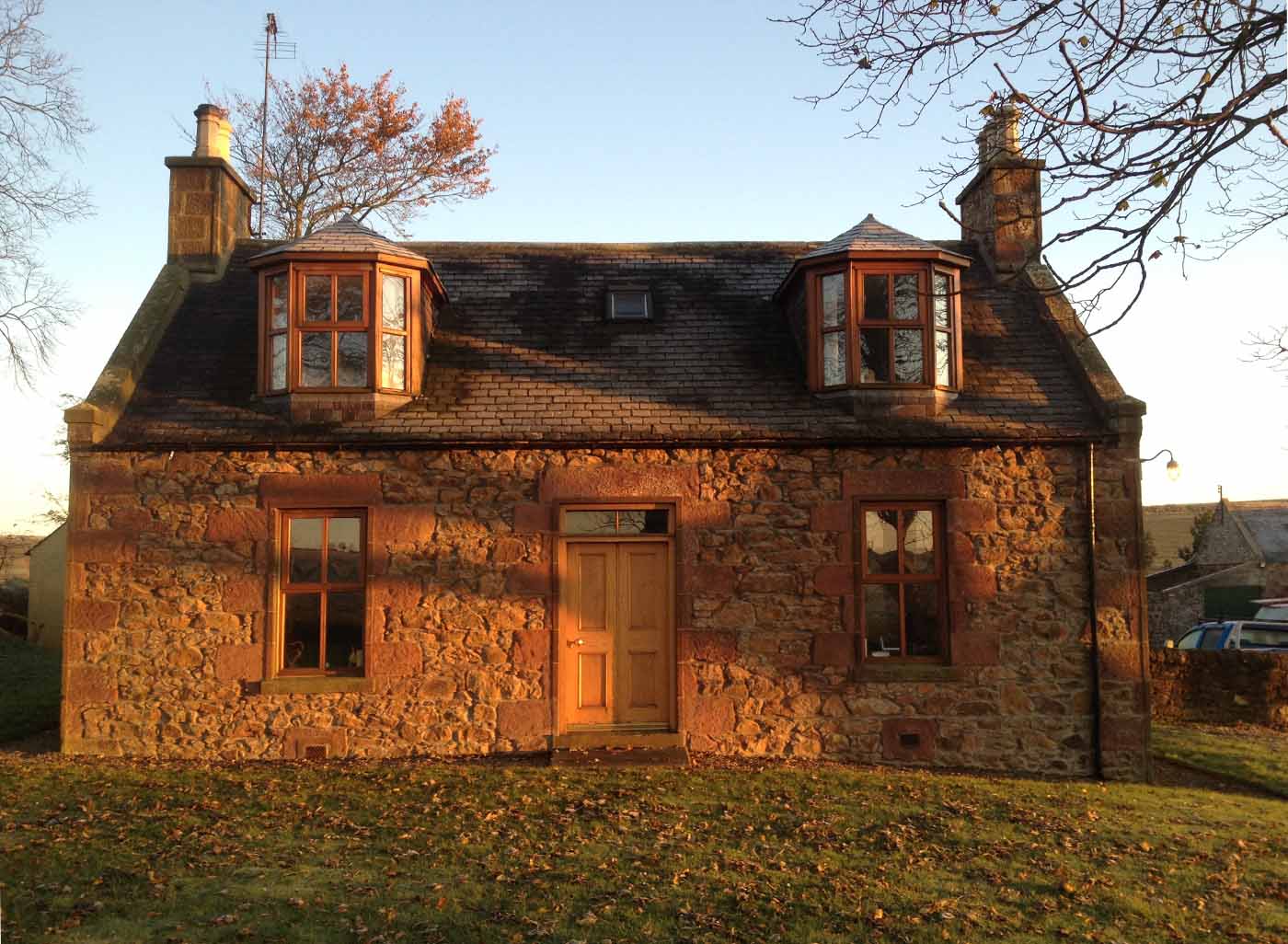 north east scotland granite house with timber front door and replacement timber windows