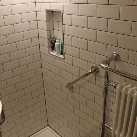 traditional white tiles in shower area