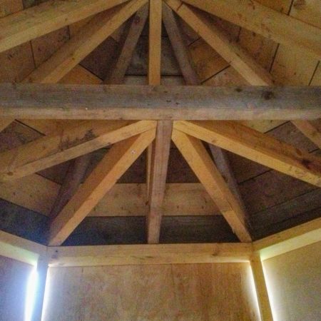 Wooden roof trusses constructed to a centre point